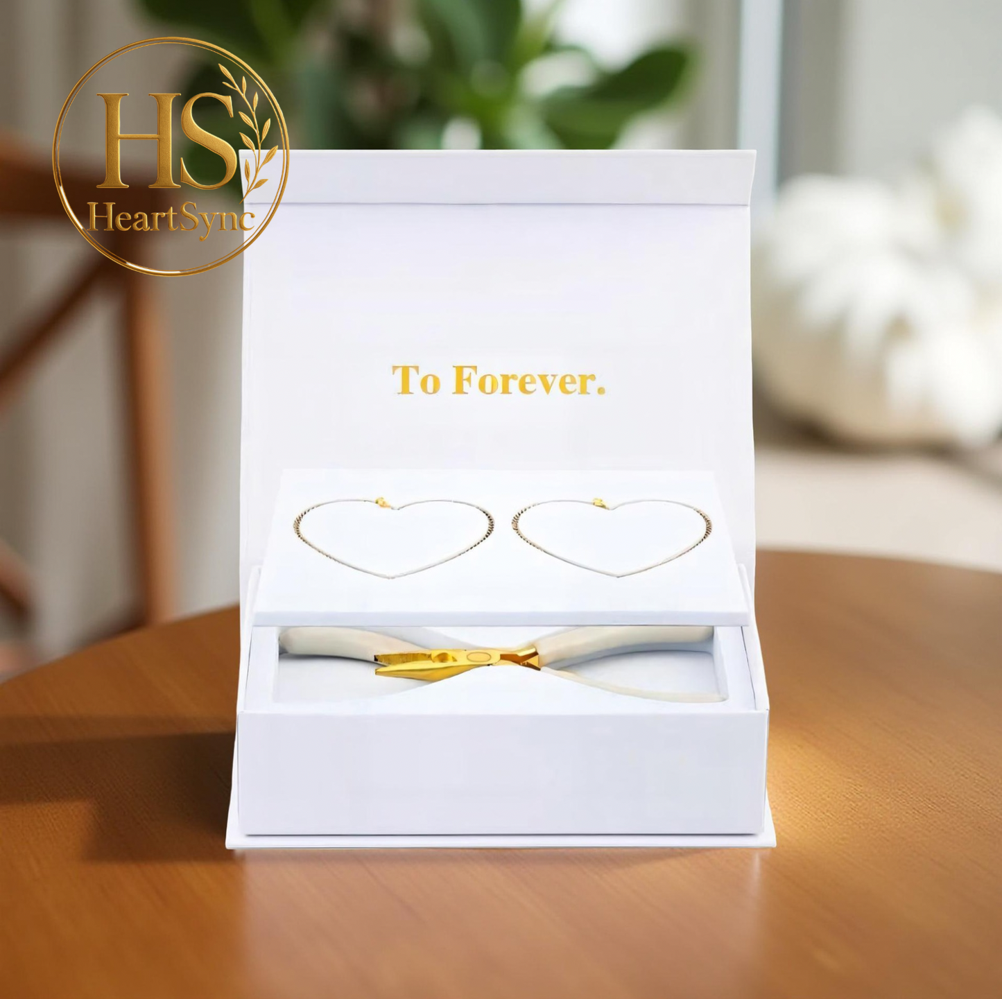 Heartsync Permanent Bracelet kit opened, showing two heart-shaped bracelets and special tools to install the bracelet. "To